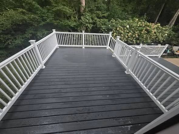 After: deck rebuild: composite deck with white railing