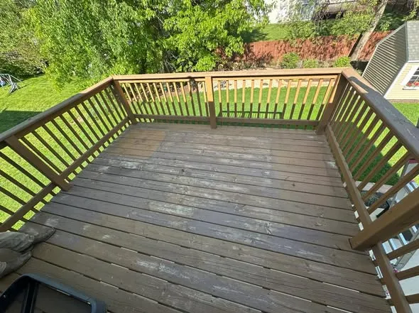 Before: deck resurfacing: worn gray boards
