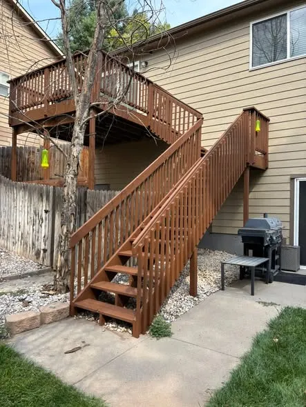 After: deck restain in Greeley: stairs in a rich brown