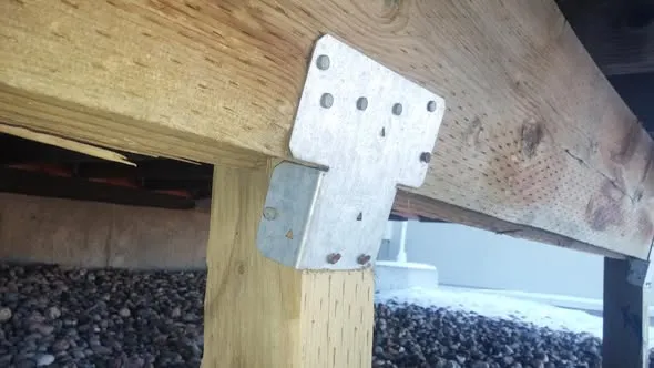 Replaced deck post secured to the beam with a galvanized metal bracket