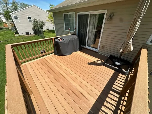 Backyard deck with fresh new deck boards installed on the existing frame