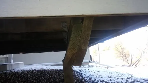 Deck support post leaning and pulling away from the beam above