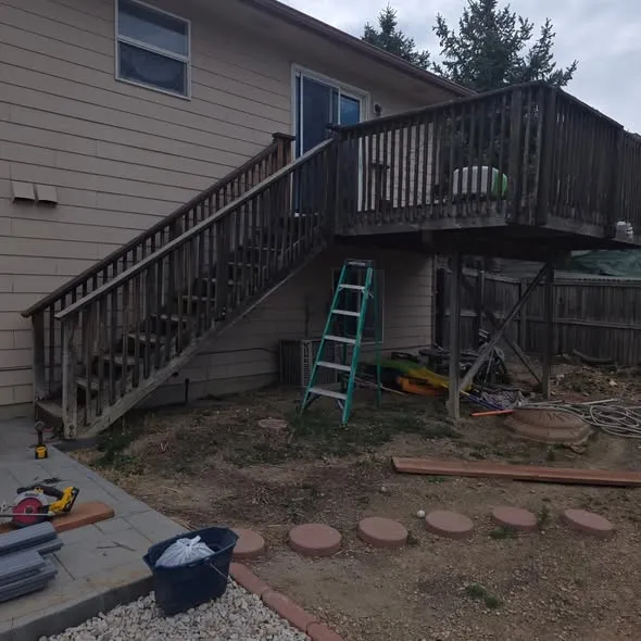 Rebuilt second-story deck with new stairs, metal balusters, and support posts