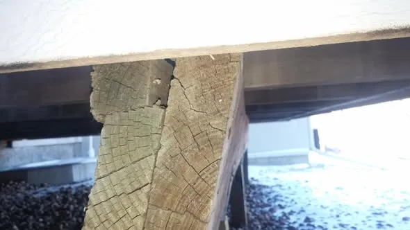 Deck post split and rotted where it meets the beam, found during a safety inspection